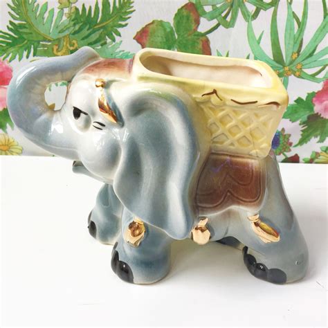 Vintage ceramic elephant planter - Vintage Ceramic Elephant Planter 5" Elephant Running. Yellow/Brown mix color. licl-9450 (483) 95.8% positive; Seller's other items Seller's other items; Contact seller; 